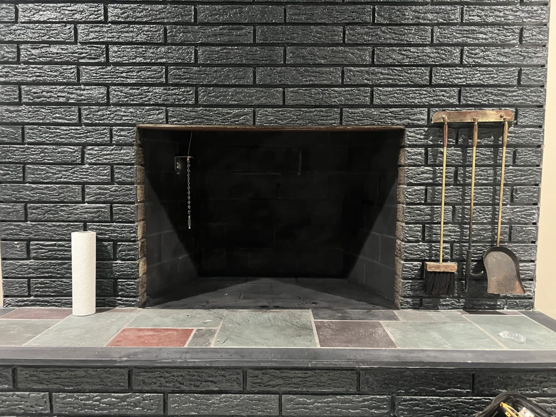 Phoenix team member performing fireplace service work