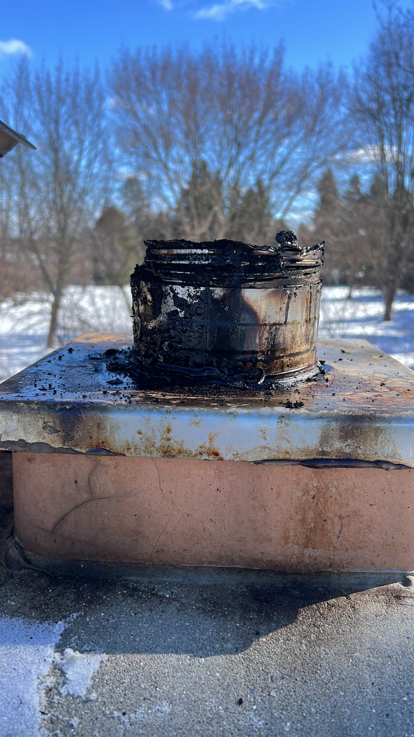 Technician servicing a fireplace component in the field.