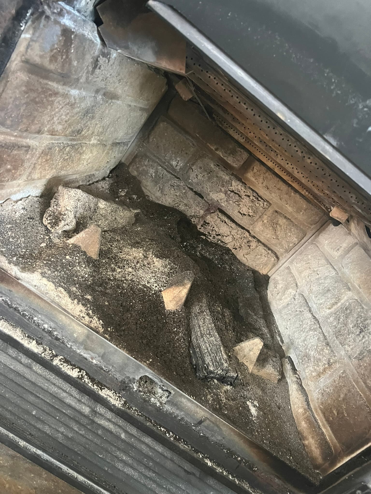 Detailed interior inspection of a fireplace unit.